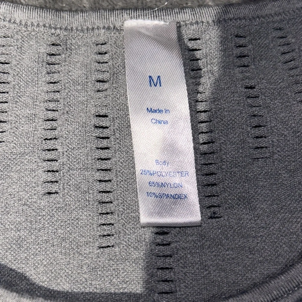 This is a workout shirt, size medium color is grey and black. - Picture 2 of 4